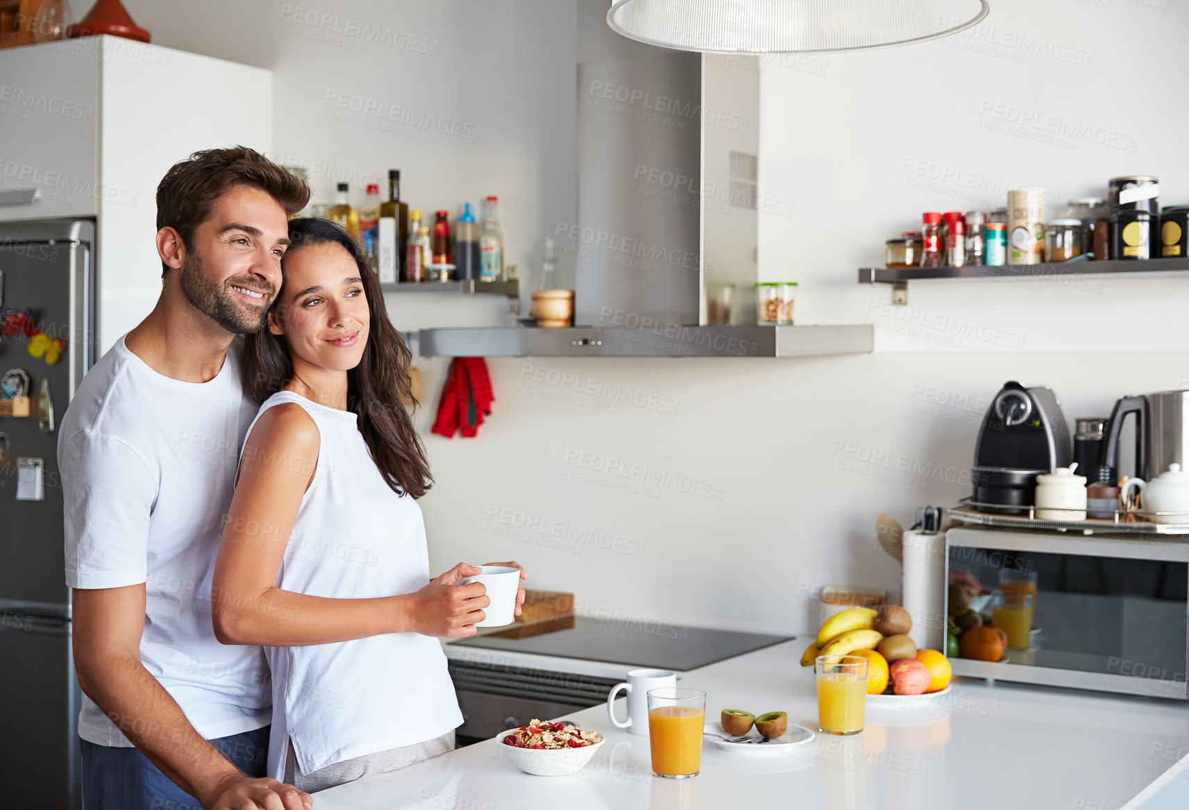 Buy stock photo Couple, relax and coffee with smile in kitchen for commitment, bonding and partner with love. Happy people, weekend morning and breakfast together for anniversary, romance and support in home