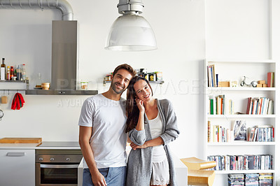 Buy stock photo Shot of a young couple spending time together in the morning at home