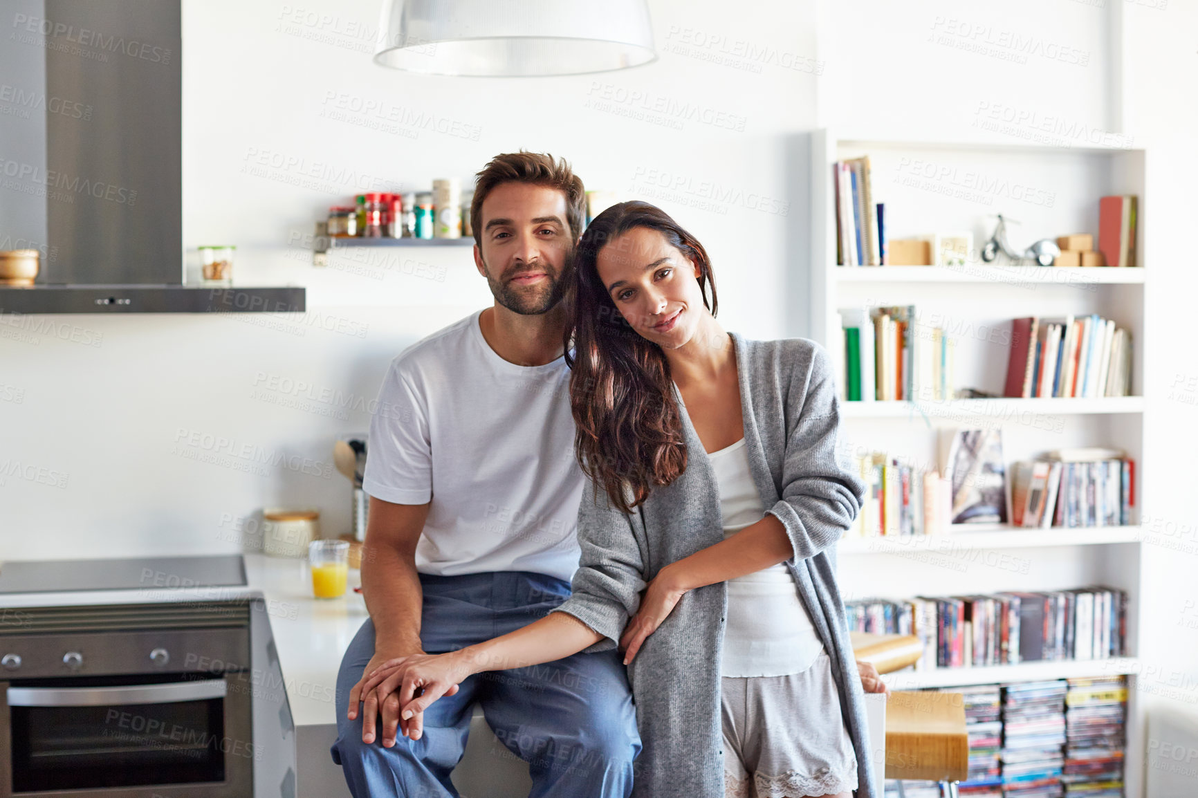 Buy stock photo Shot of a young couple spending time together in the morning at home
