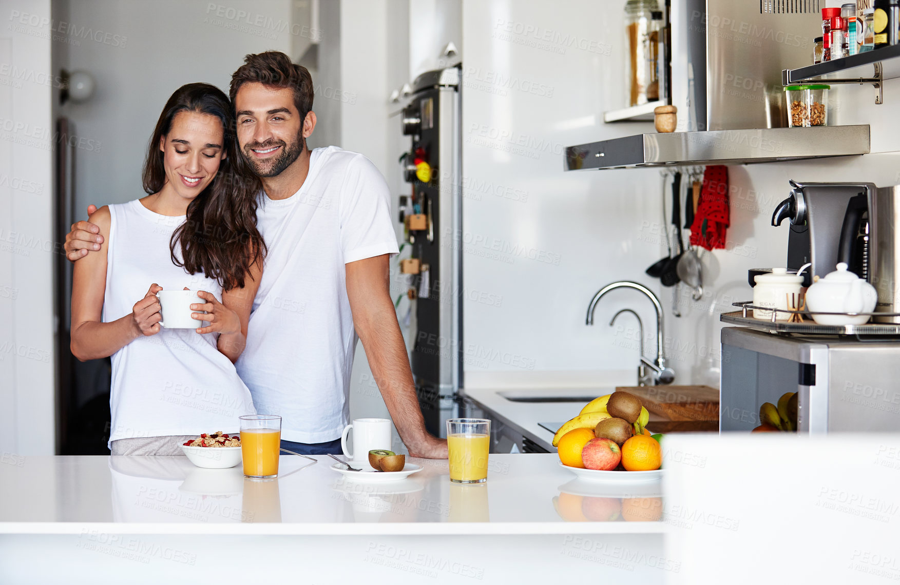 Buy stock photo Shot of a young couple having a relaxing breakfast together at home