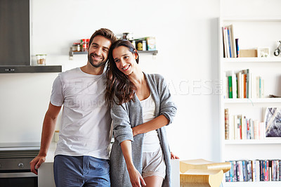 Buy stock photo Shot of an affectionate young couple spending time together in the morning at home