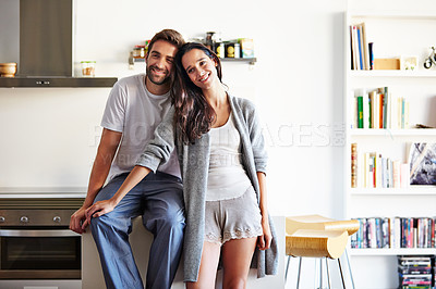 Buy stock photo Shot of an affectionate young couple spending time together in the morning at home