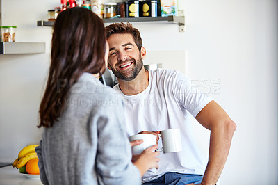 Buy stock photo Shot of a young couple spending time together in the morning at home