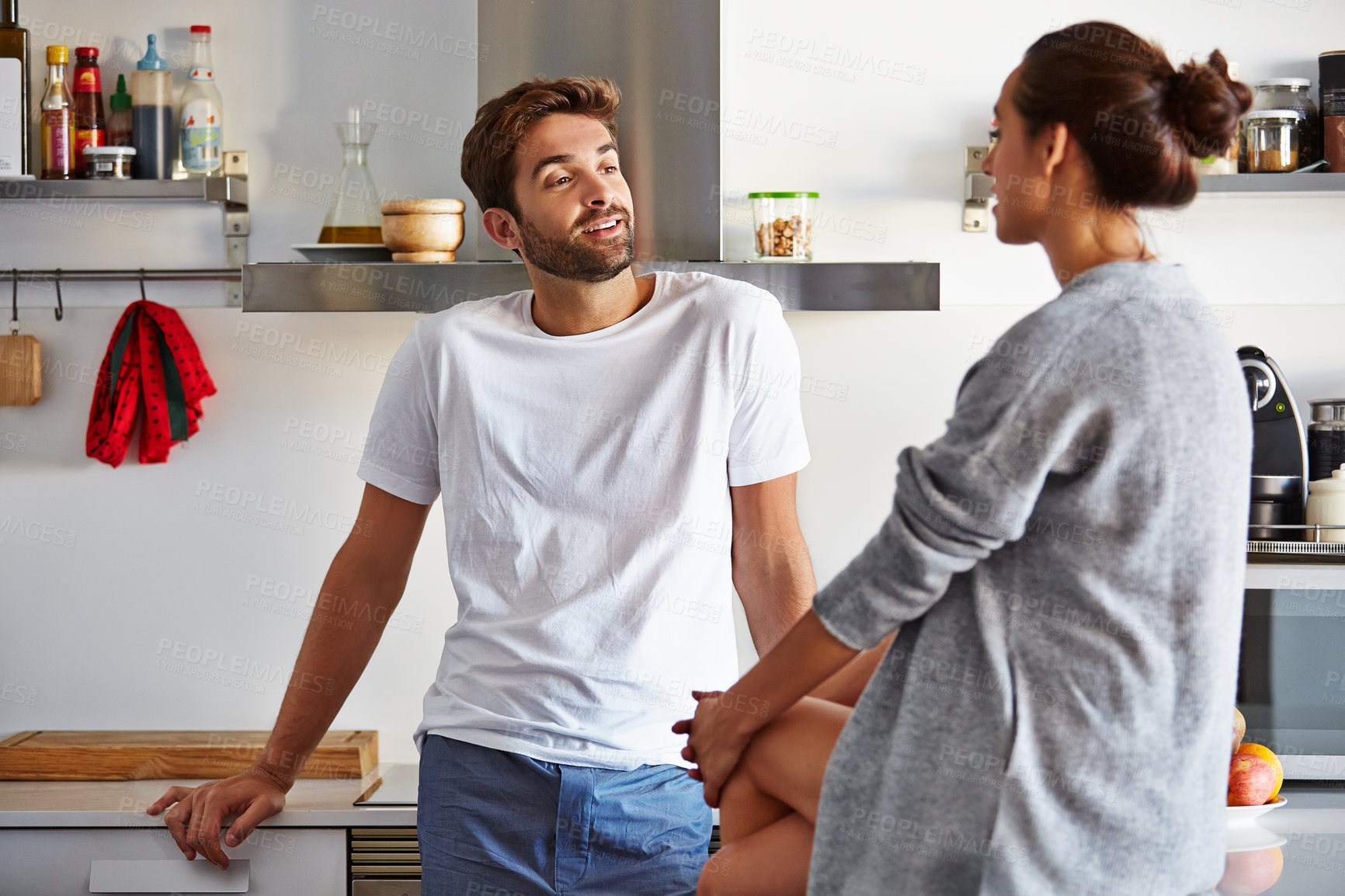 Buy stock photo Shot of a young couple spending time together in the morning at home