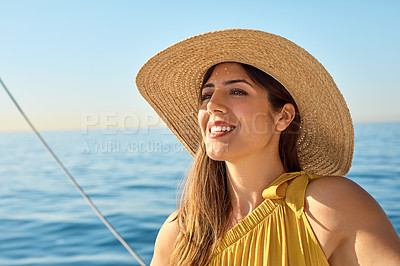 Buy stock photo Shot of a beautiful young woman going for an ocean cruise on a boat