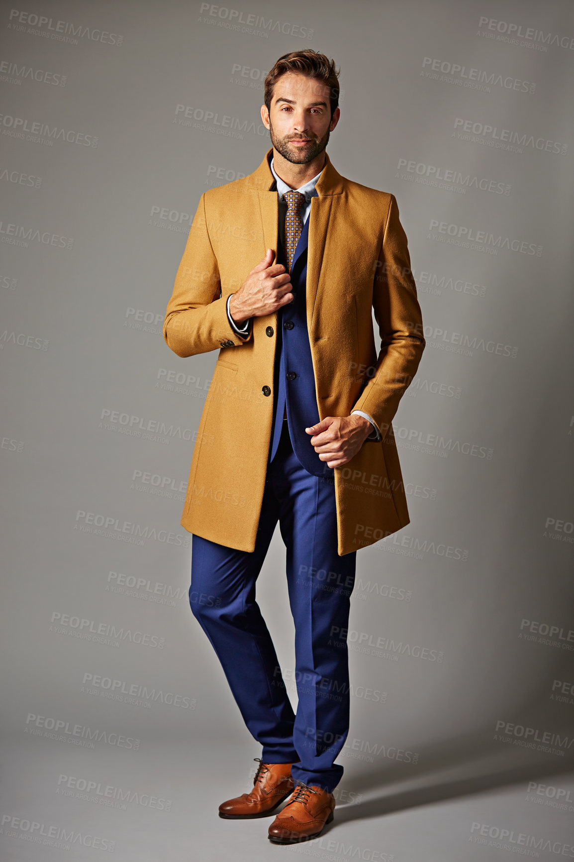 Buy stock photo Businessman, portrait and pride in studio with professional suit, designer or corporate fashion. Person, confidence and coat for business style, gray background and outfit for career aesthetic