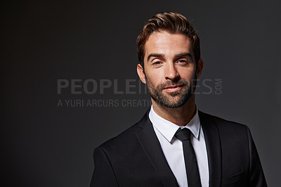Buy stock photo Cropped portrait of a handsome young businessman standing against a grey background
