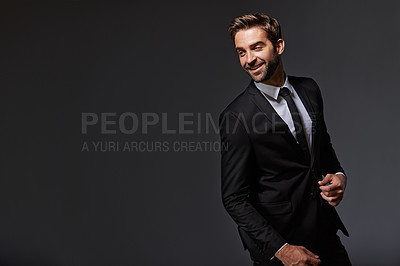 Buy stock photo Cropped shot of a handsome young businessman standing against a grey background