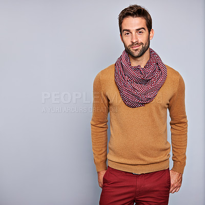 Buy stock photo Studio portrait of a handsome young man posing against a grey background