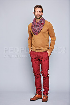 Buy stock photo Studio portrait of a handsome young man posing against a grey background