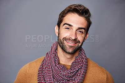 Buy stock photo Studio portrait of a handsome young man posing against a grey background