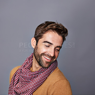 Buy stock photo Studio shot of a handsome young man posing against a grey background
