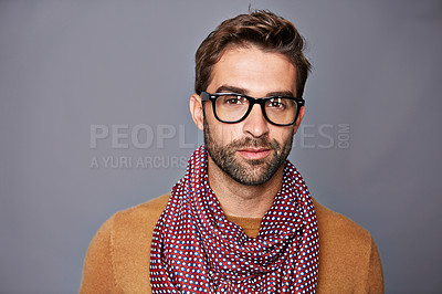 Buy stock photo Studio portrait of a handsome young man posing against a grey background