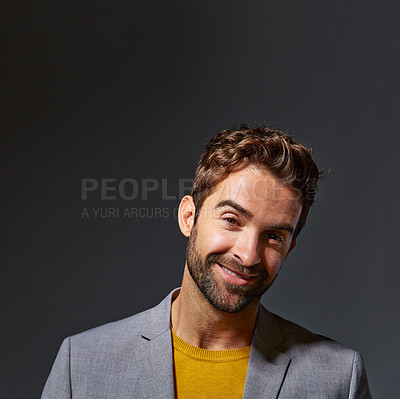 Buy stock photo Studio portrait of a handsome young businessman standing against a grey background