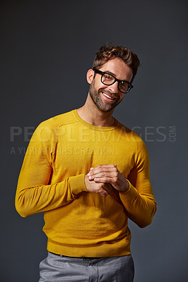 Buy stock photo Studio portrait of a handsome man posing against a grey background
