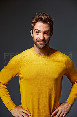 Buy stock photo Studio portrait of a handsome man posing against a grey background