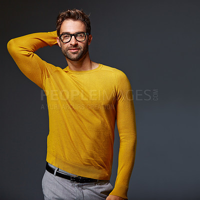 Buy stock photo Studio portrait of a handsome man posing against a grey background
