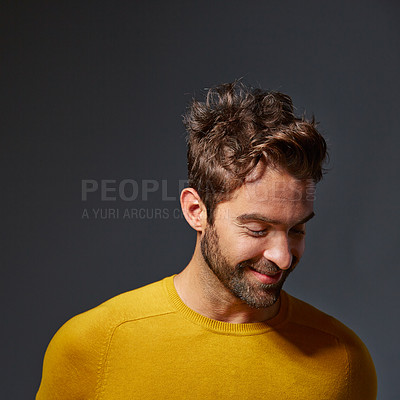 Buy stock photo Studio shot of a handsome man posing against a grey background