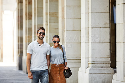 Buy stock photo Shot of an affectionate young couple exploring a foreign city