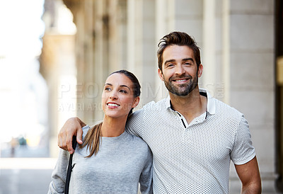 Buy stock photo Shot of an affectionate young couple exploring a foreign city