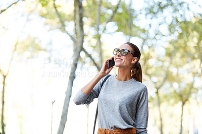 Buy stock photo Cropped shot of a young woman walking through the city
