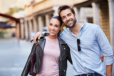 Buy stock photo Shot of an affectionate young couple exploring a foreign city
