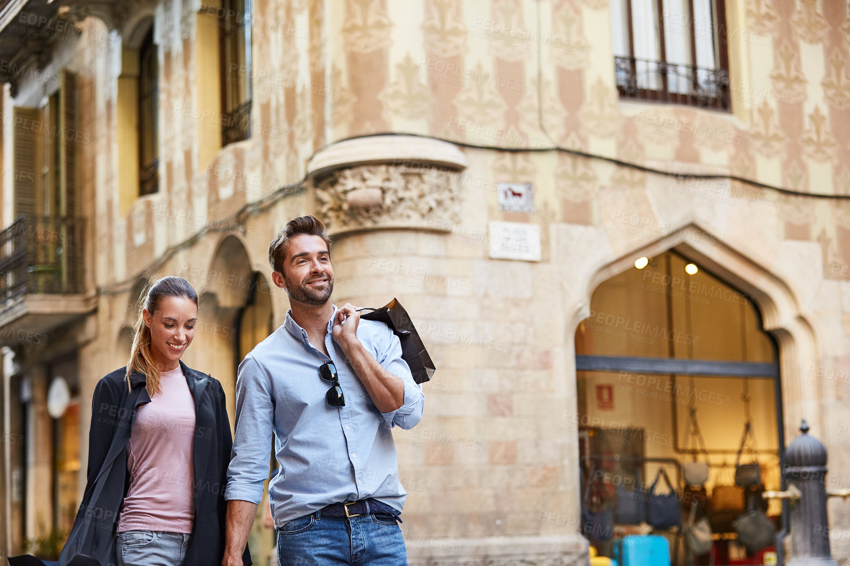 Buy stock photo Holiday, walking and couple in city with shopping bag for bonding, weekend outing and travel. Happy, dating and man with woman in town for connection, tourism and sightseeing for vacation abroad