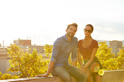 Buy stock photo Shot of a couple out on a rooftop for their date