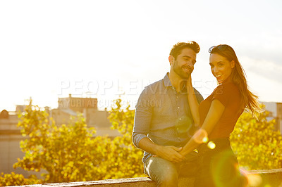 Buy stock photo Shot of a couple out on a rooftop for their date