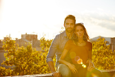 Buy stock photo Shot of a couple out on a rooftop for their date
