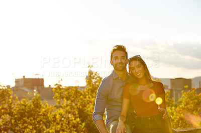 Buy stock photo Shot of a couple out on a rooftop for their date