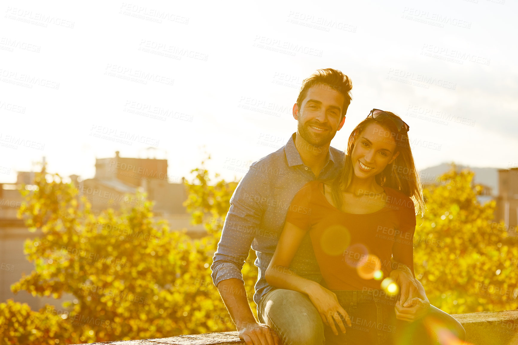 Buy stock photo Shot of a couple out on a rooftop for their date
