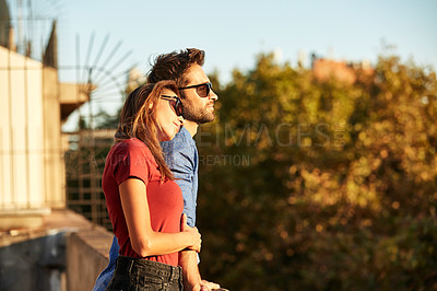 Buy stock photo Shot of an affectionate young couple exploring a foreign city