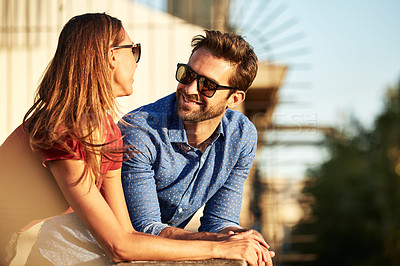 Buy stock photo Shot of an affectionate young couple exploring a foreign city