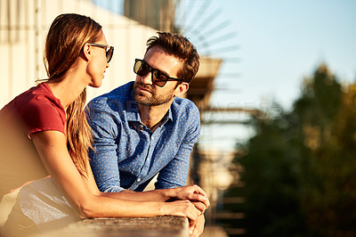 Buy stock photo Shot of an affectionate young couple exploring a foreign city