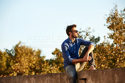 Buy stock photo Cropped shot of a man on a rooftop