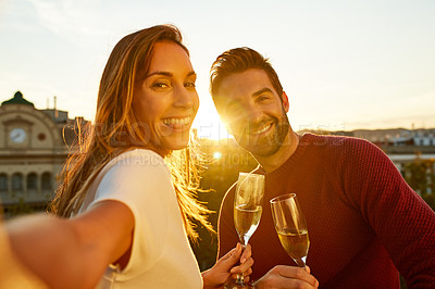 Buy stock photo Shot of a couple taking a selfie while out on a date