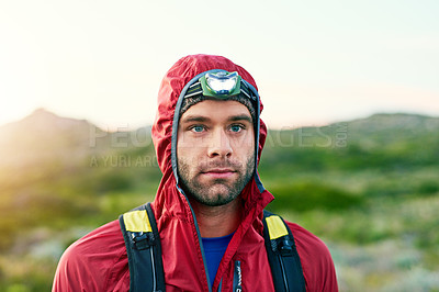 Buy stock photo Cropped shot of a handsome young male athlete out for a morning run