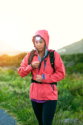 Buy stock photo Cropped shot of an attractive young female athlete out for a morning run