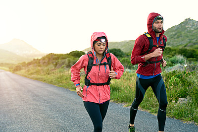 Buy stock photo Cropped shot of a young couple out for a morning run