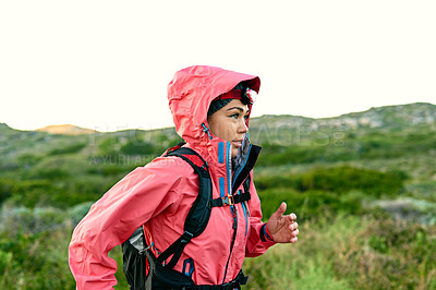Buy stock photo Cropped shot of an attractive young female athlete out for a morning run