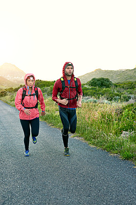Buy stock photo Full length shot of a young couple out for a morning run