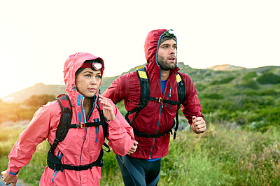 Buy stock photo Cropped shot of a young couple out for a morning run