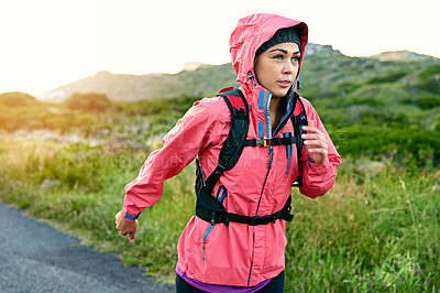 Buy stock photo Cropped shot of an attractive young female athlete out for a morning run