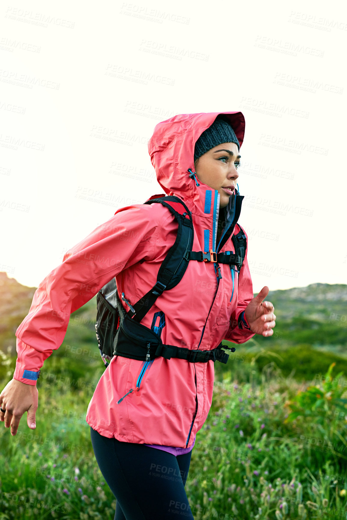 Buy stock photo Cropped shot of an attractive young female athlete out for a morning run