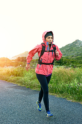 Buy stock photo Full length shot of an attractive young female athlete out for a morning run
