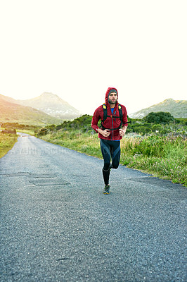 Buy stock photo Full length shot of a handsome young male athlete out for a morning run
