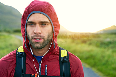 Buy stock photo Cropped shot of a handsome young male athlete out for a morning run