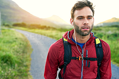 Buy stock photo Cropped shot of a handsome young male athlete out for a morning run