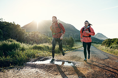 Buy stock photo Full length shot of a young couple out for a morning run
